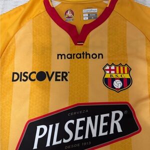 The Marathon Clothing Gold and Red Soccer Jersey